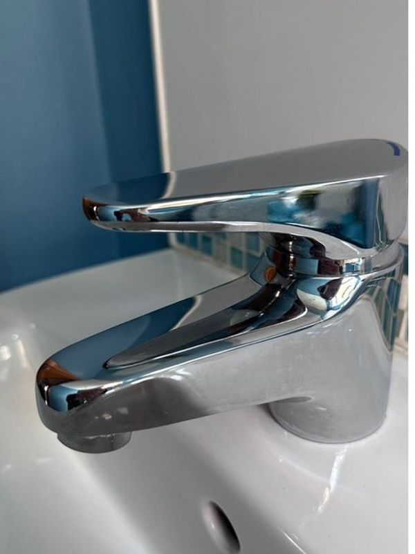 After: the basin mixer tap descaled to a mirror finish
