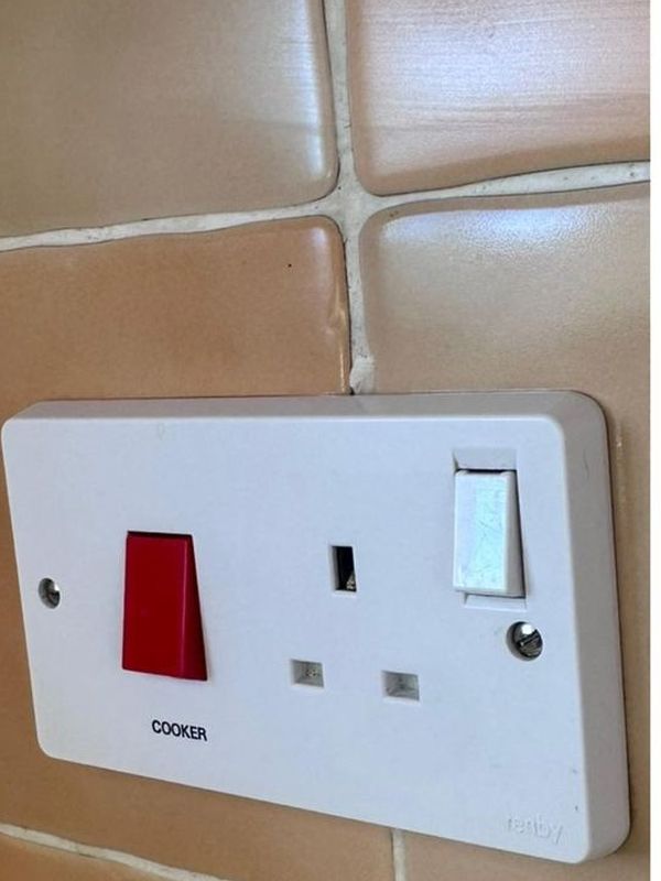 After: the socket and switch plate wiped spotless