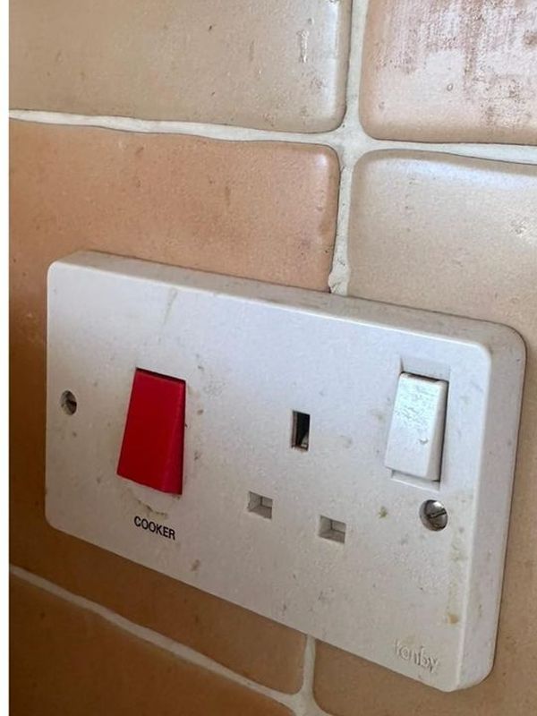 Before: the grubby socket and switch plate